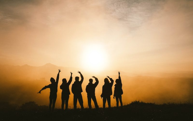 silhouette photo of six persons on top of mountain